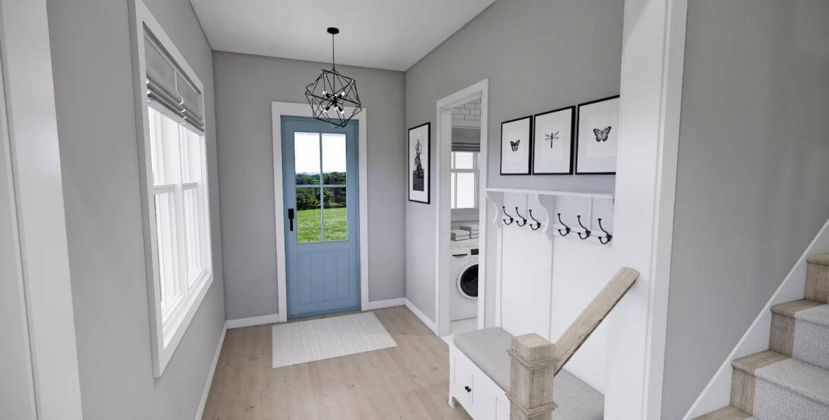 Foyer with a blue glazed door, coat hooks, and a cushioned bench.