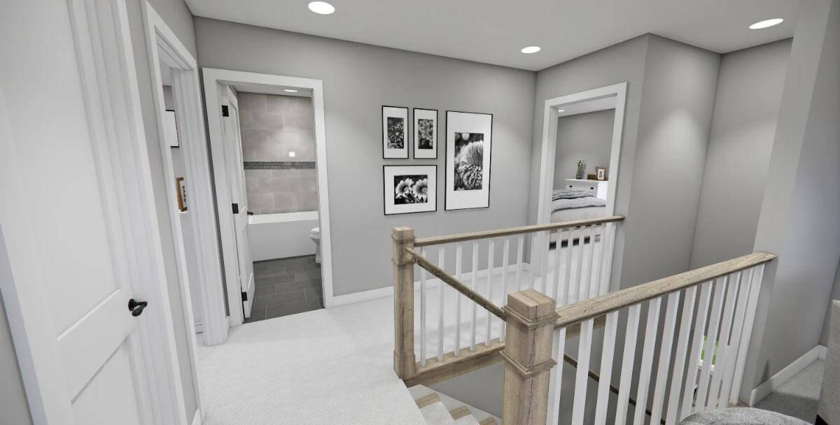 Upstairs hall with wooden railings and a carpeted floor.