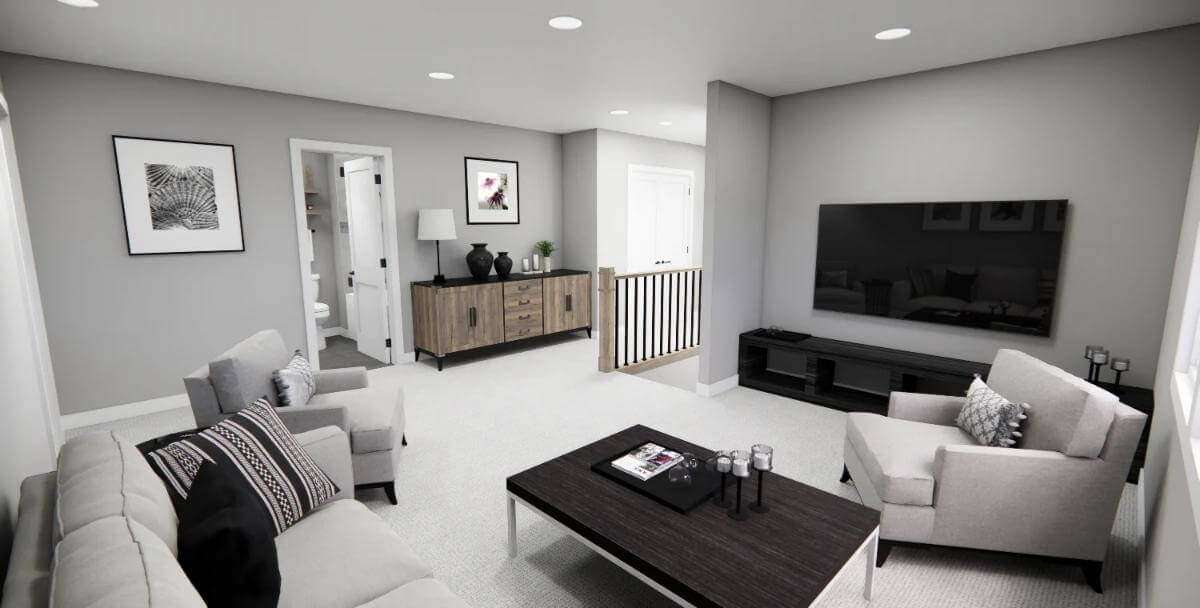 Loft with gray seats and a wall-mounted TV.