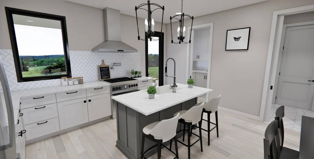 Kitchen with white cabinets and a breakfast island with seating for three.