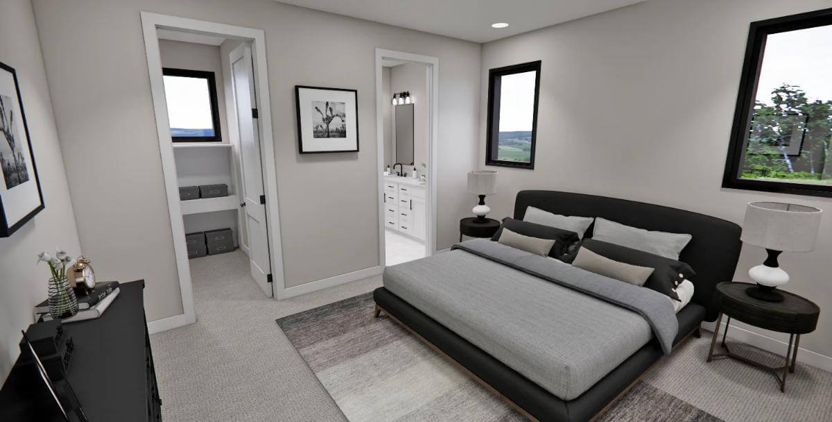 Primary bedroom with an upholstered bed, a walk-in closet, and an ensuite full bath.