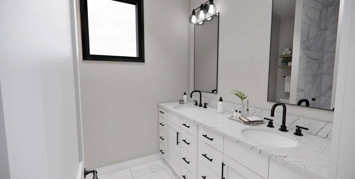 Primary vanity with two sinks, a marble countertop, and framed mirrors.