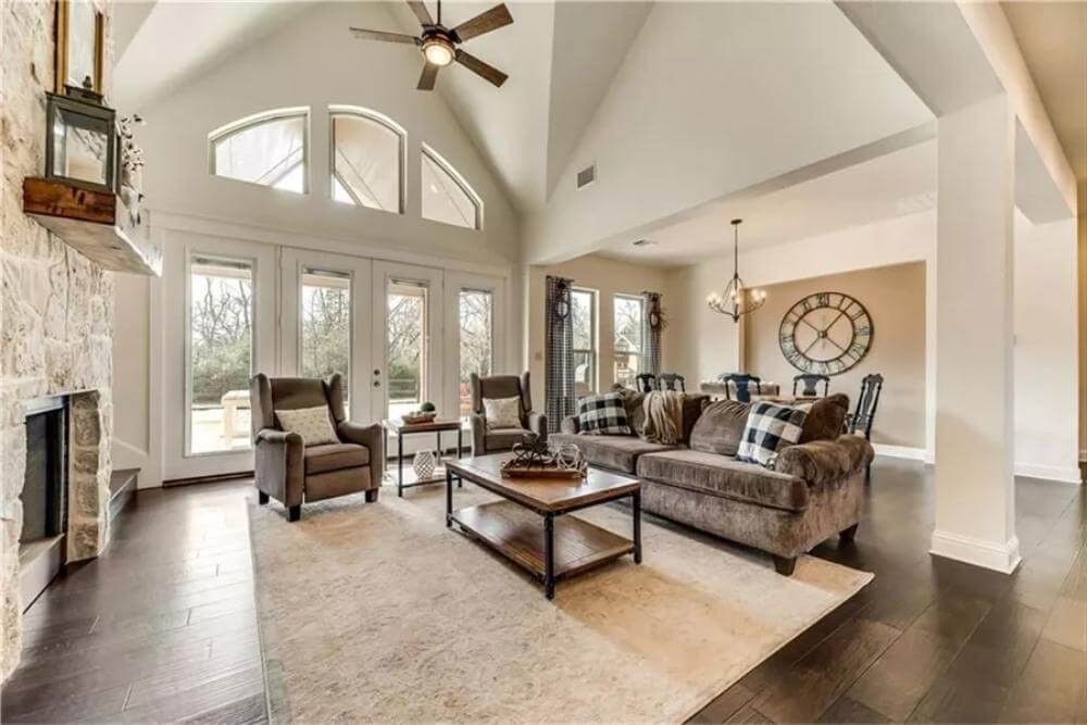 A wall of windows floods the great room with natural light.