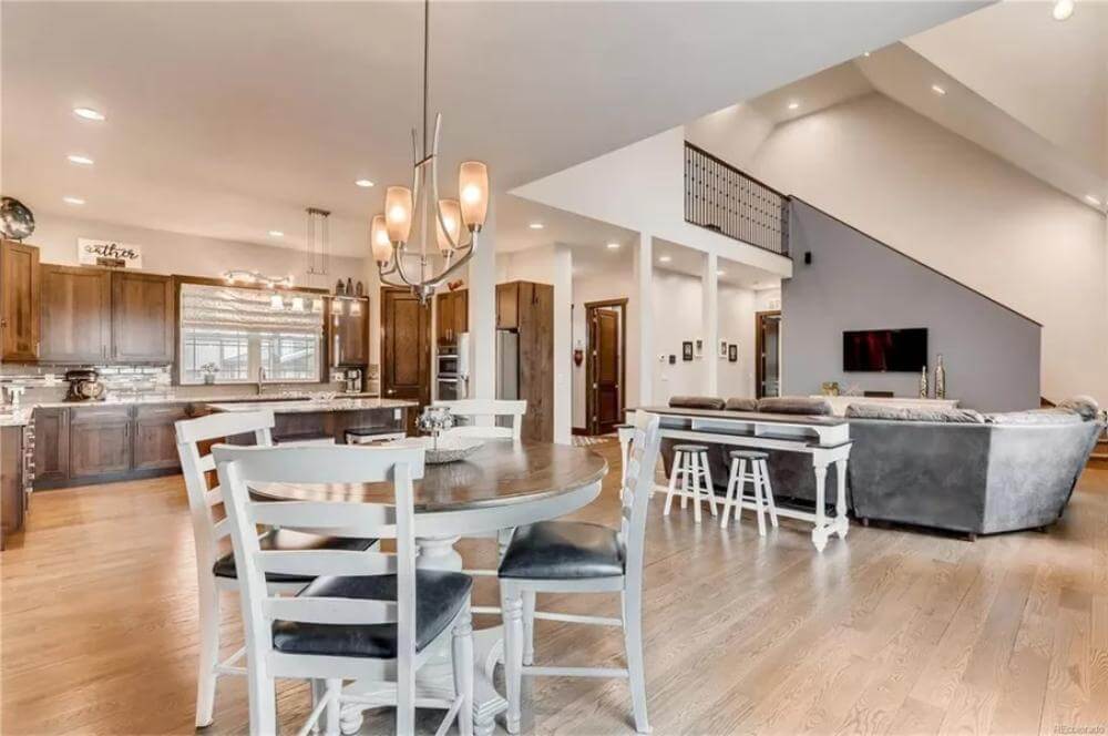 Breakfast nook with a round dining set and great views of the open living space.
