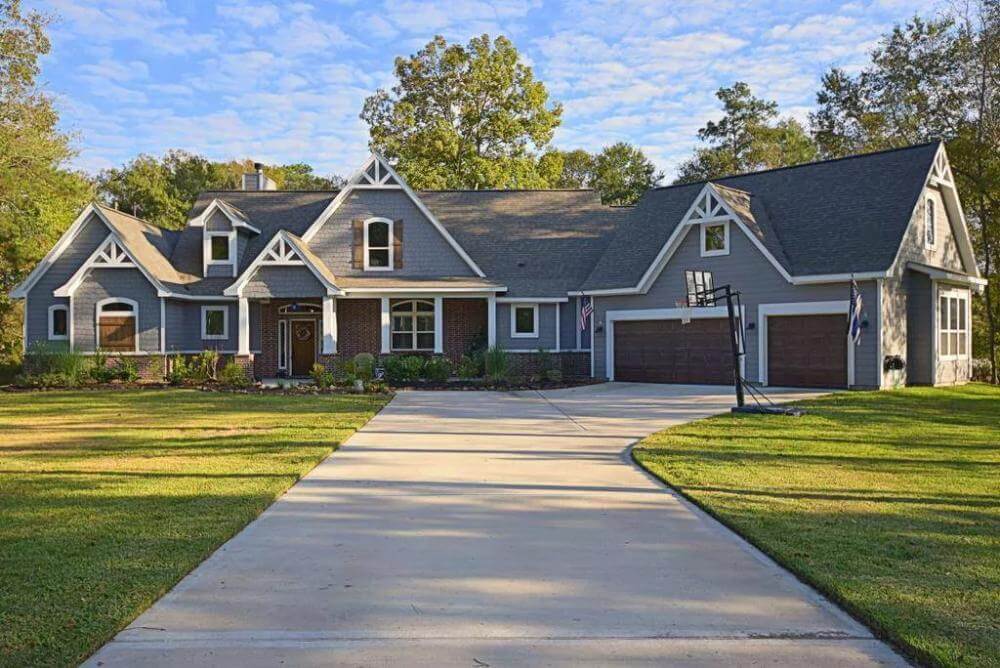 Front porch with a covered entry porch and an angled 3-car garage.