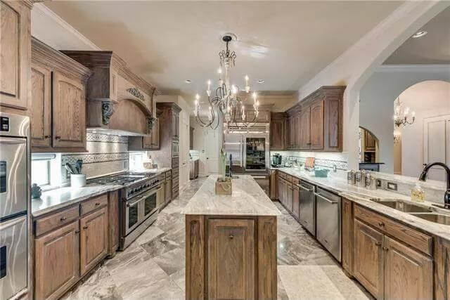 The kitchen includes high-end appliances and a center island.
