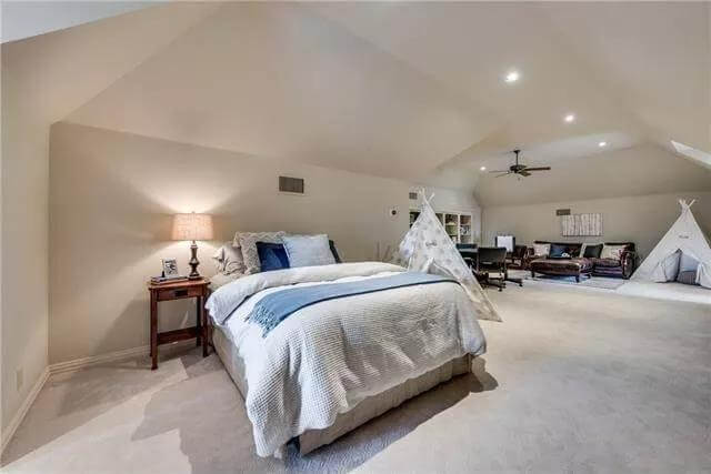 Bonus room with a platform bed, teepee tent, and a spacious sitting area.