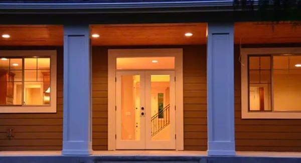 Rear patio with a French door and decorative columns.