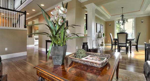 Living room and dining room defined by interior columns.