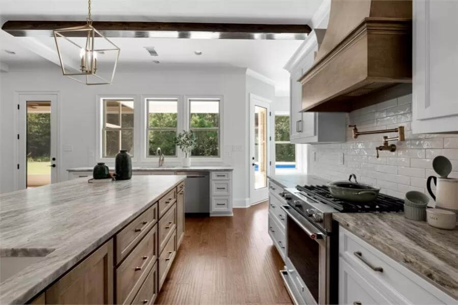 The kitchen includes marble countertops and access to the back porch.