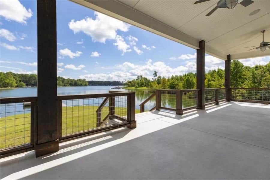 Covered porch with concrete flooring and timber pillars.