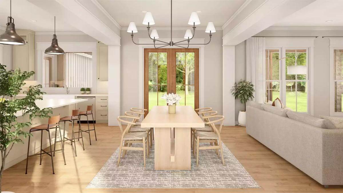 Dining area with a light wood dining set and a French door that opens to the back porch.