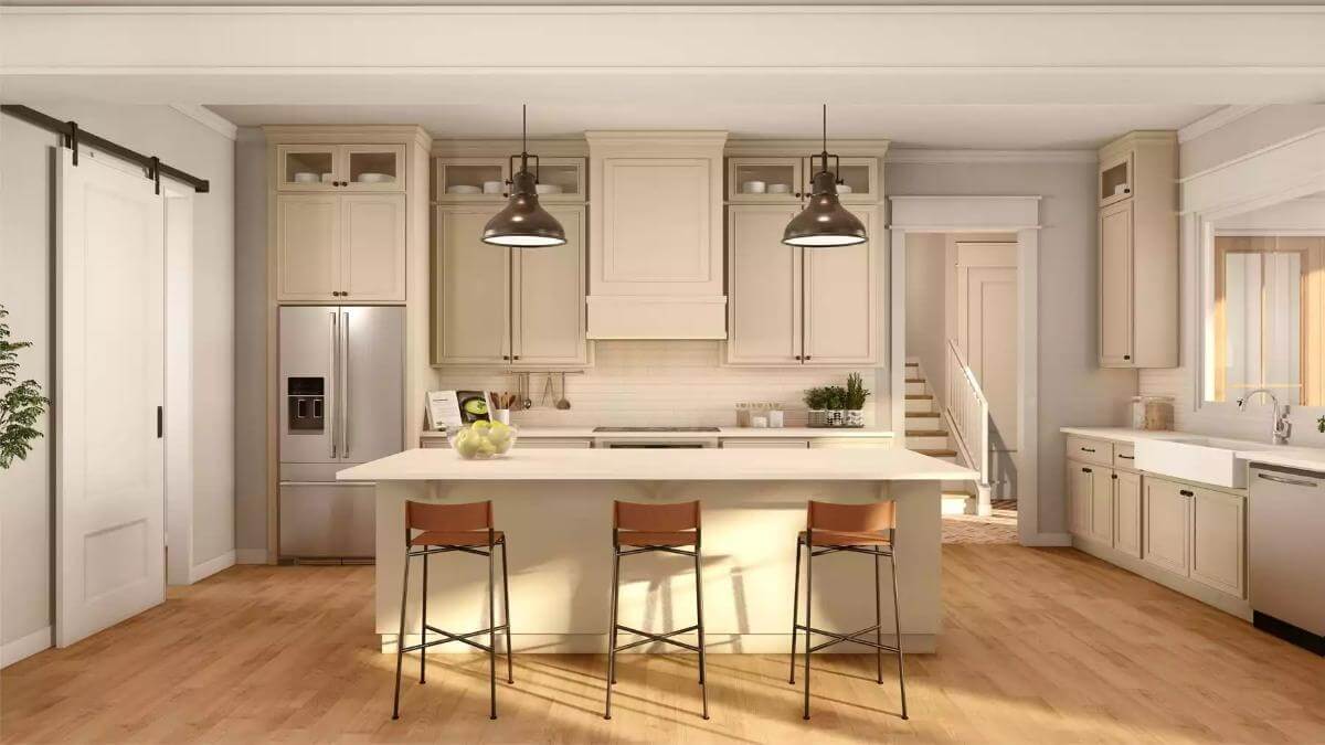 Kitchen with cream cabinets, premium appliances, and a breakfast island with seating for three.