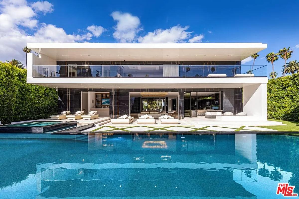 Rear view of the mansion with a pool.