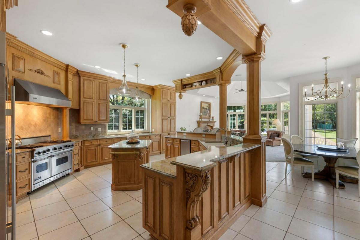 Kitchen with custom cabinetry and a center island prep area.