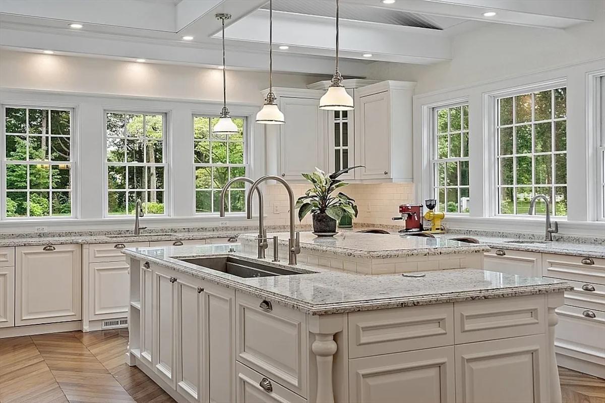 Kitchen with custom cabinetry and a center island prep area.