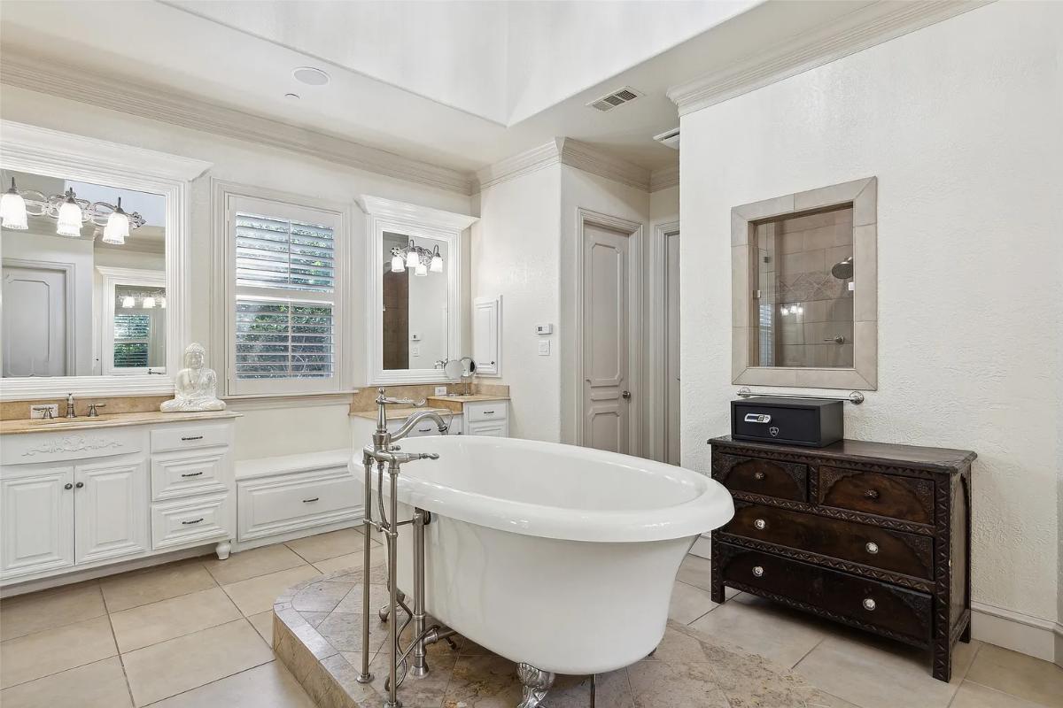 Bathroom with a custom-made vanity and a soaking tub.