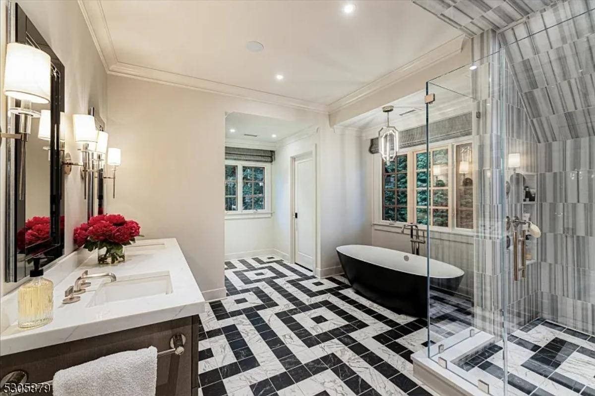 Bathroom with a custom-made vanity, a soaking tub and a walk-in shower.