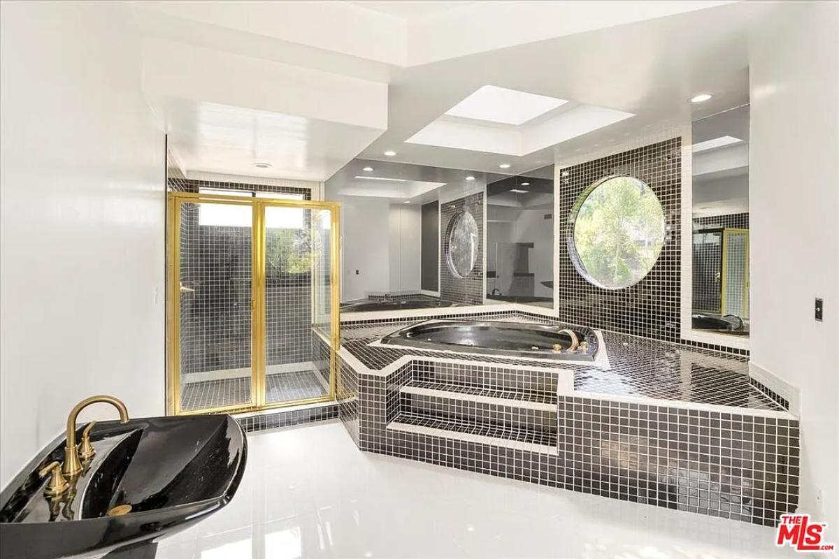 Bathroom with a soaking tub and a walk-in shower.
