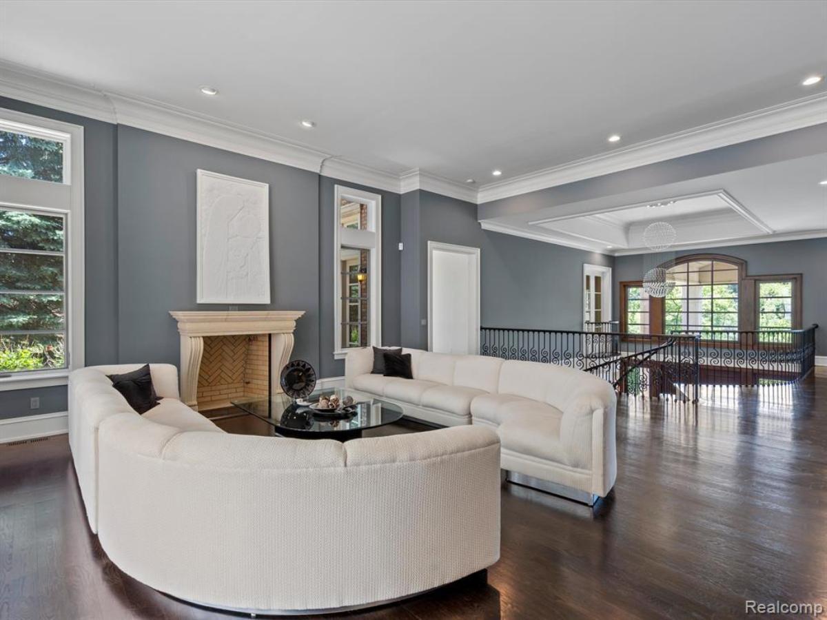 Living room with couches and a fireplace.