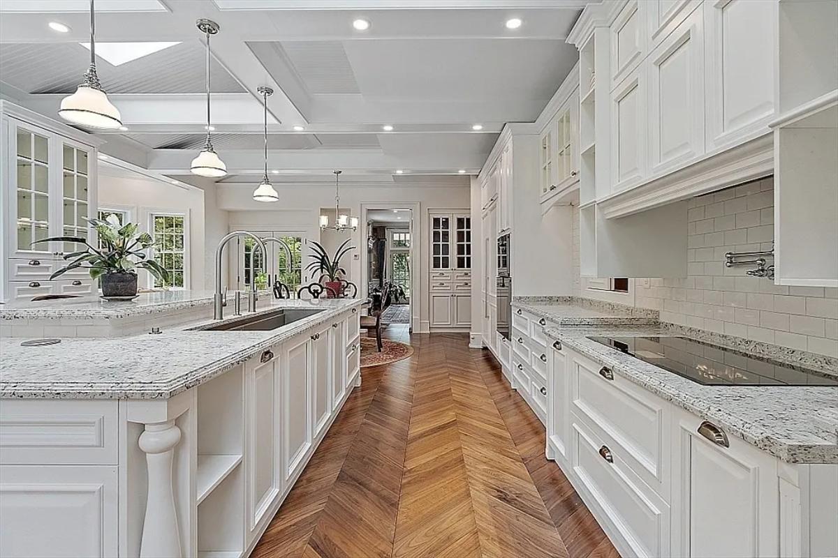 Kitchen with custom cabinetry and an island prep area.