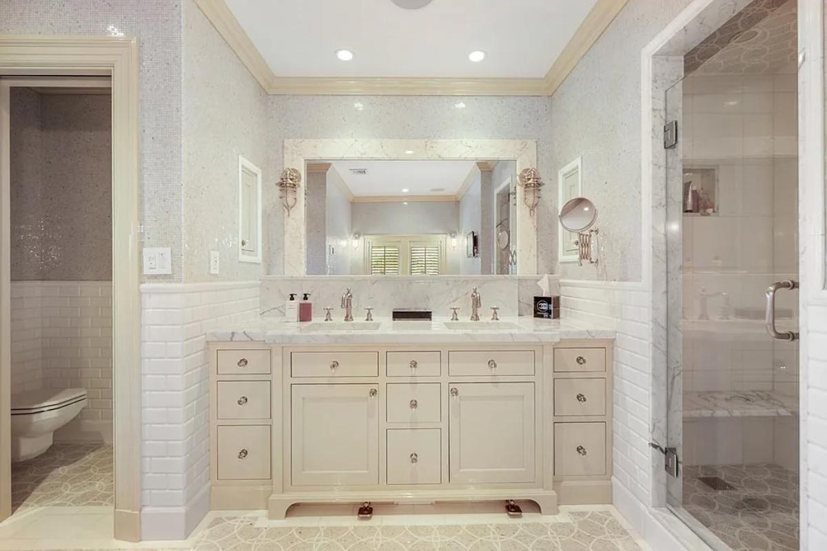 Bathroom with a sink, toilet and a walk-in shower.