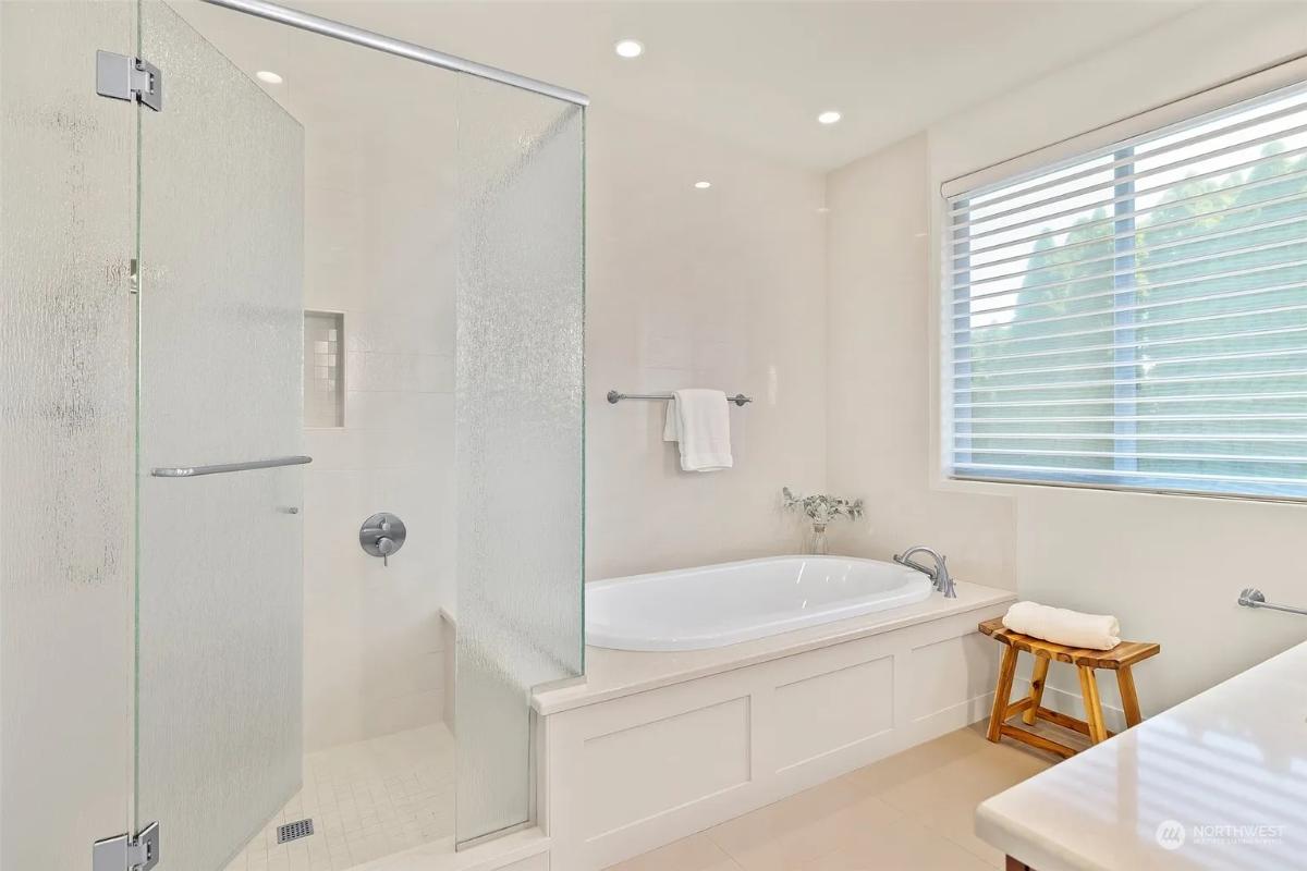 Bathroom with a soaking tub and a walk-in shower.