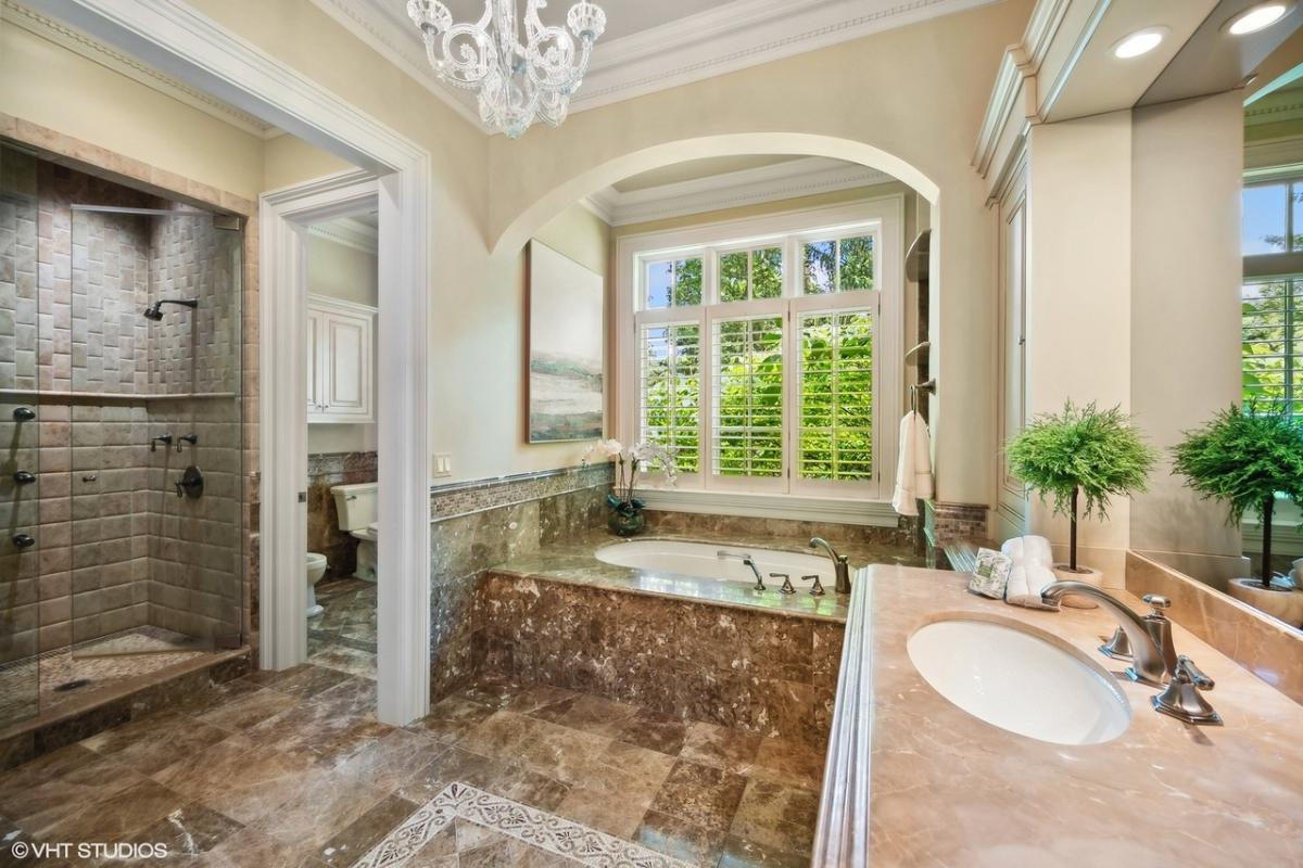 Bathroom with a sink, a soaking tub and a walk-in shower.