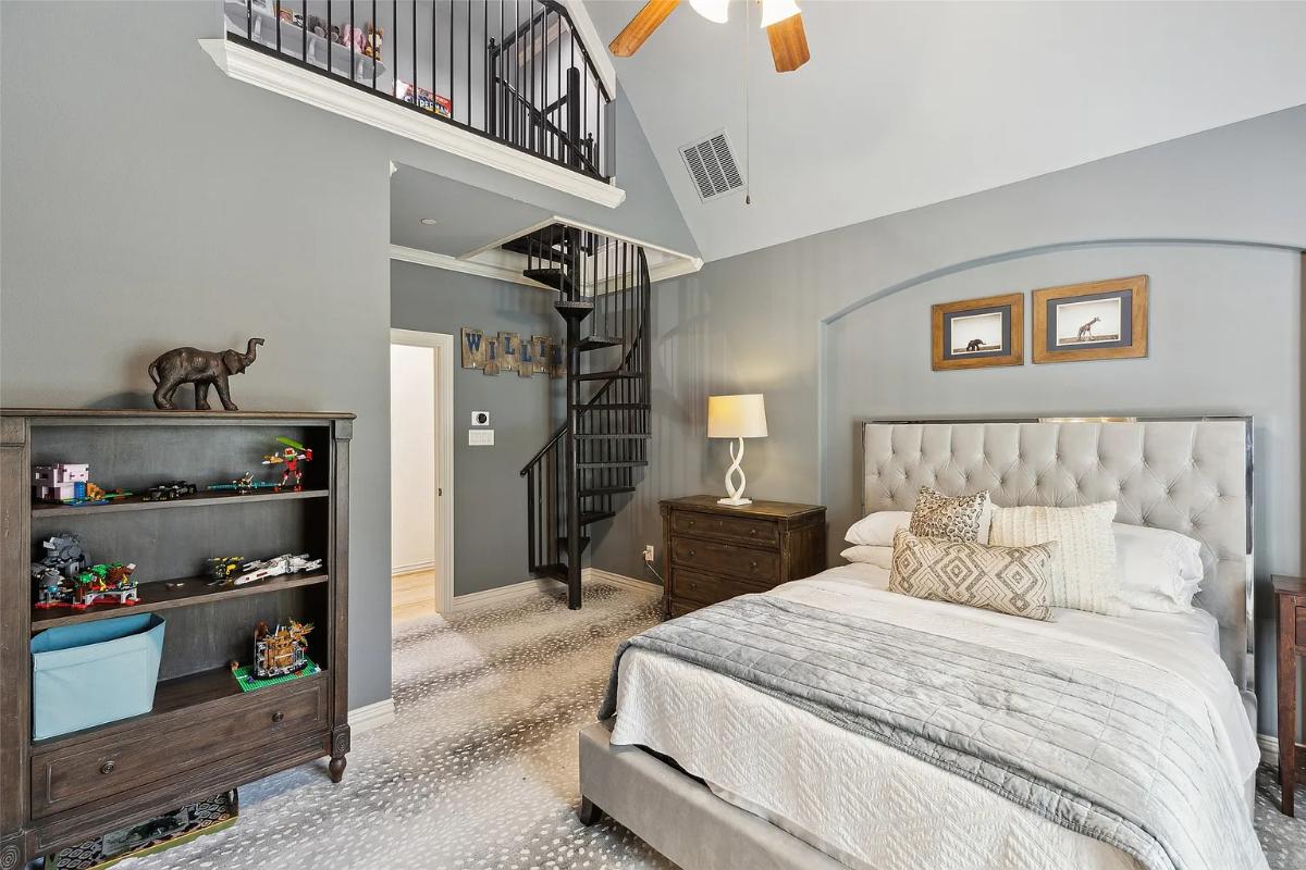 Bedroom with a spiral staircase.