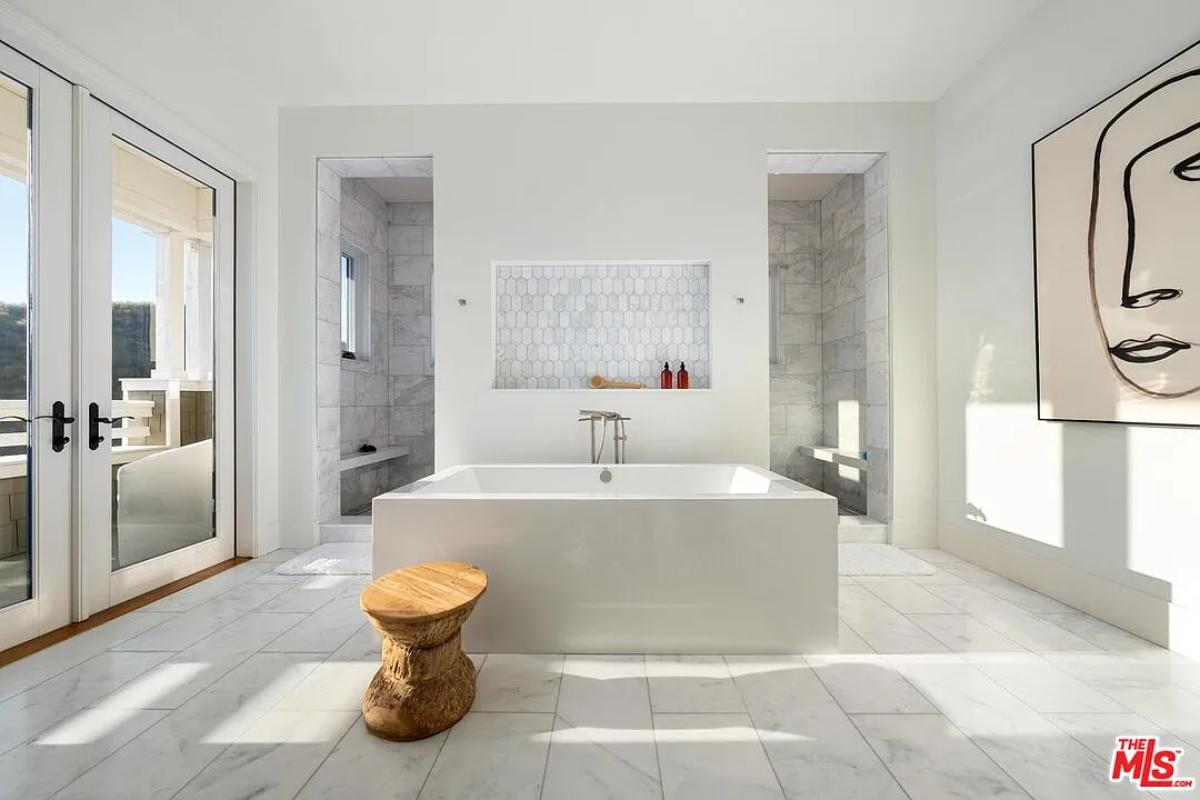 Bathroom with a soaking tub and a walk-in shower.