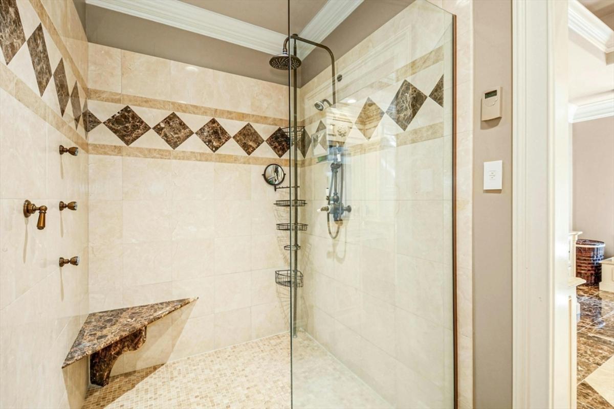 Bathroom with a walk-in shower.