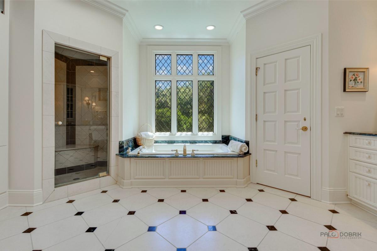 Bathroom with a soaking tub and a walk-in shower.