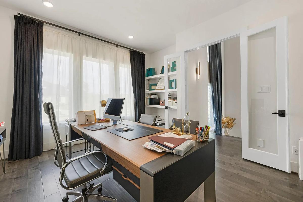 Home office with hardwood floors.