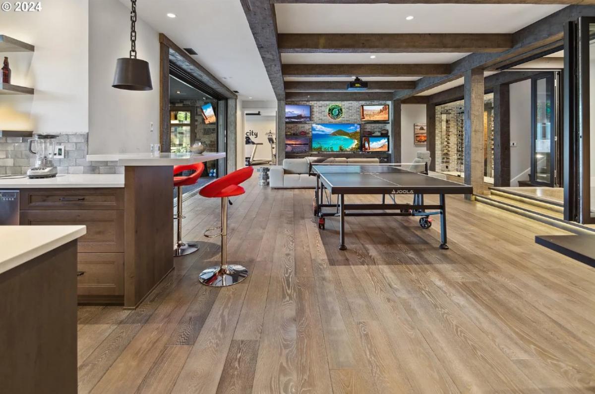 Recreation room with a table tennis and couches.