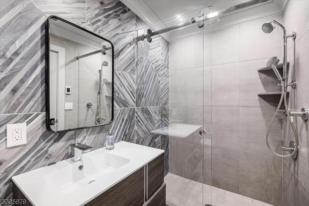 Bathroom with a sink and a walk-in shower.