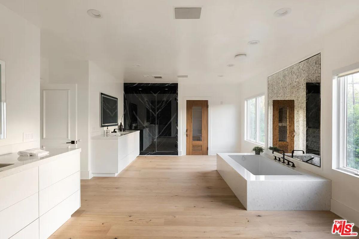 Bathroom with a custom-made vanity and a soaking tub.