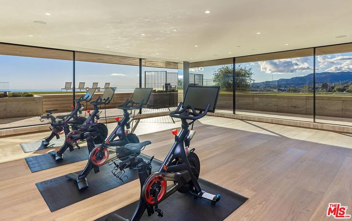 Home gym with glass walls.