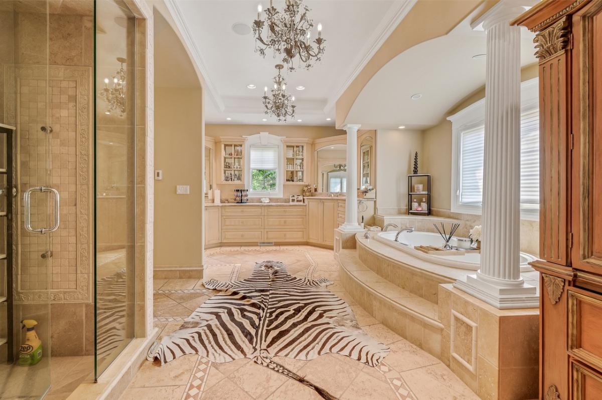 Bathroom with a custom-made vanity, a soaking tub and a walk-in shower.