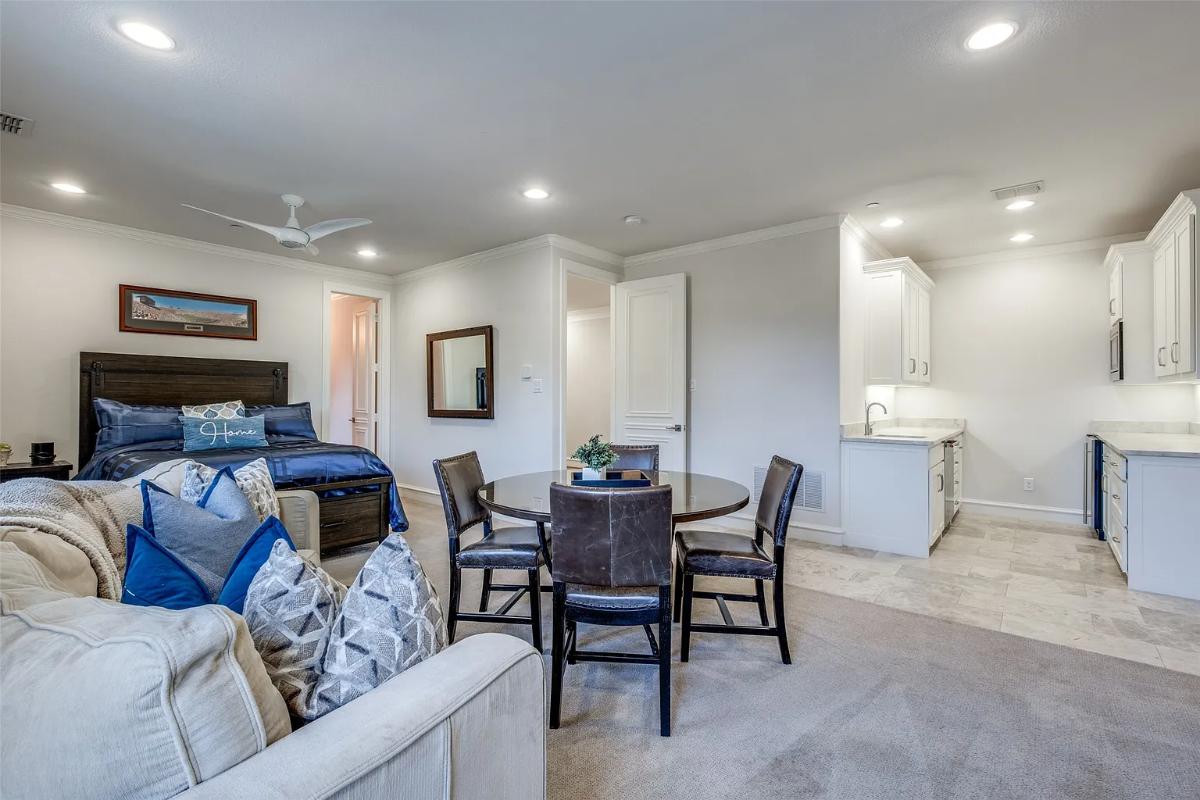 Guest suite with a private kitchen, living space and bath.