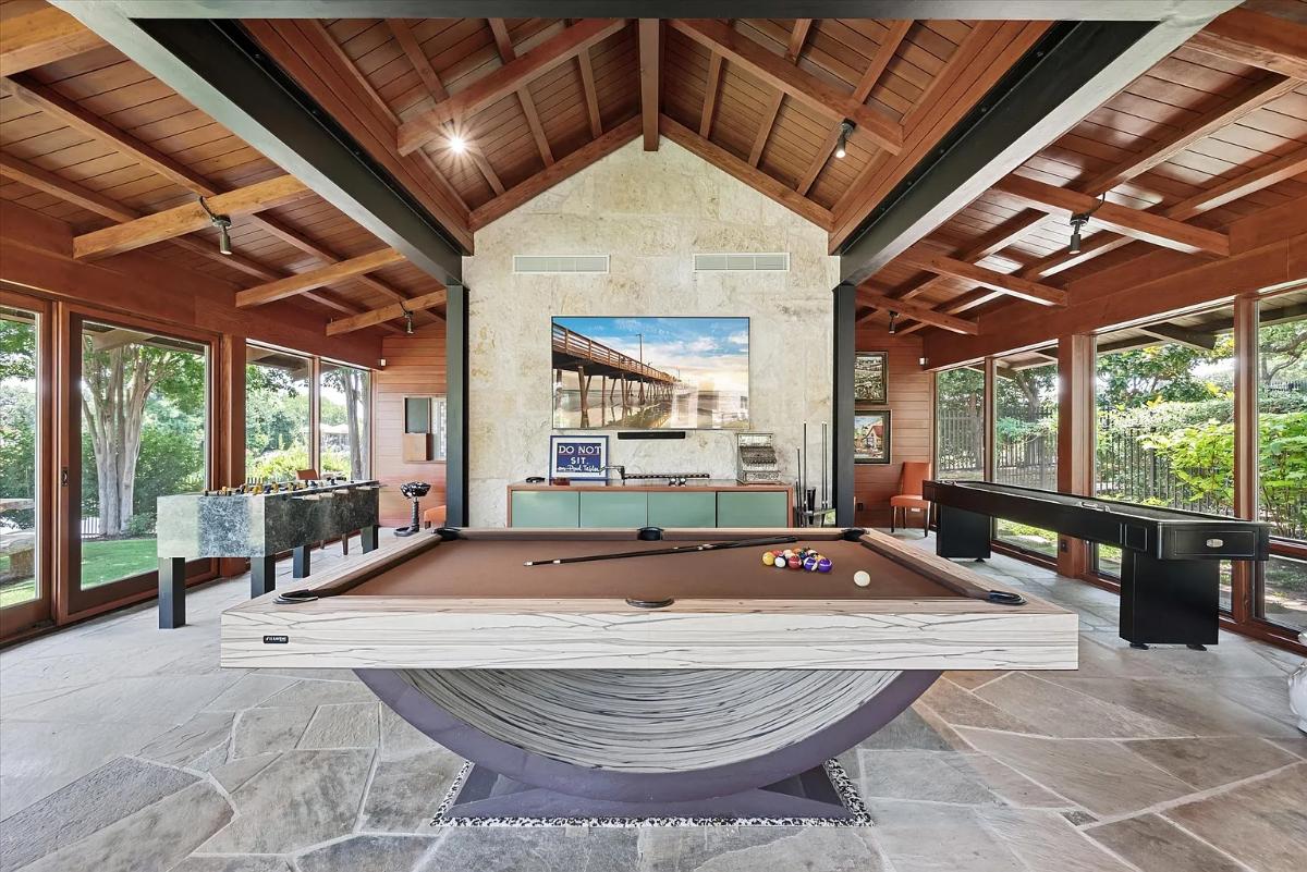 Recreation room with a billiards table.