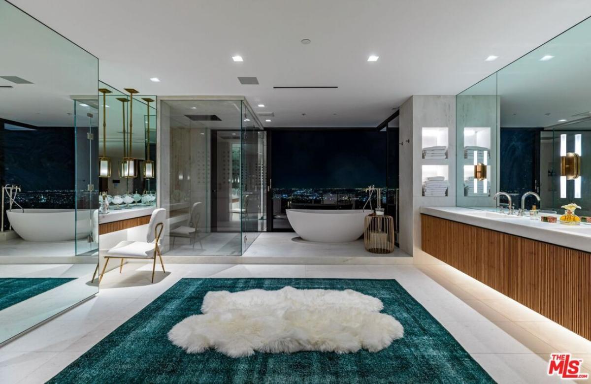 Bathroom with a custom-made vanity, a soaking tub and a walk-in shower.
