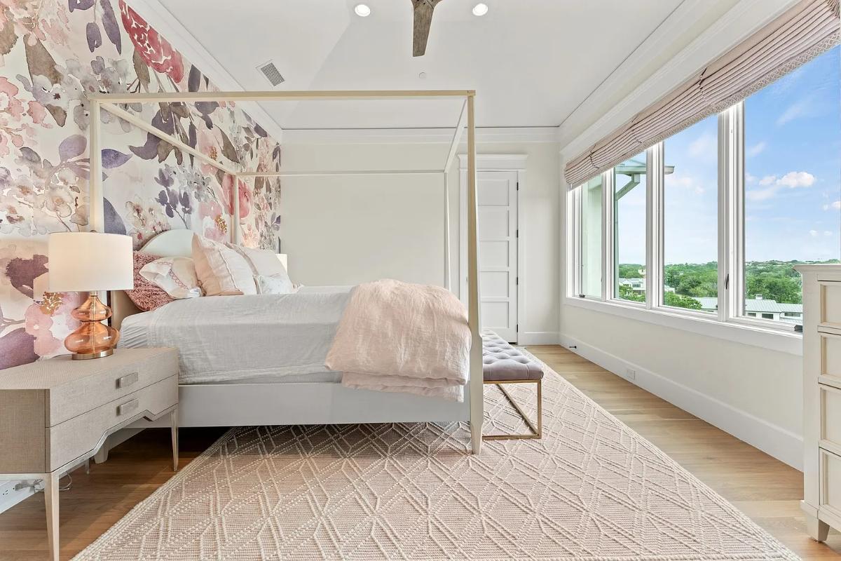 Bedroom with hardwood floors and glass windows.