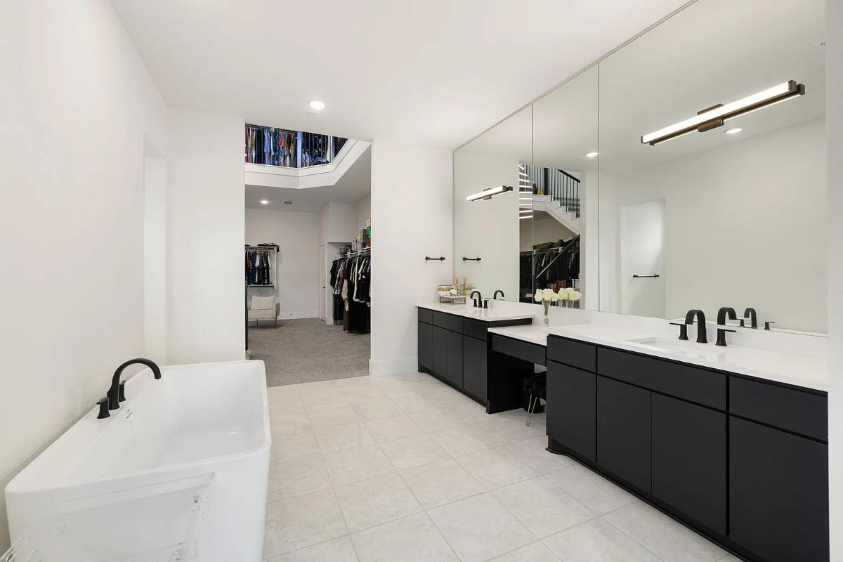 Bathroom with a custom-made vanity and a soaking tub.