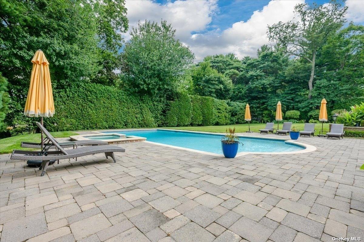 Pool with lounge chairs.