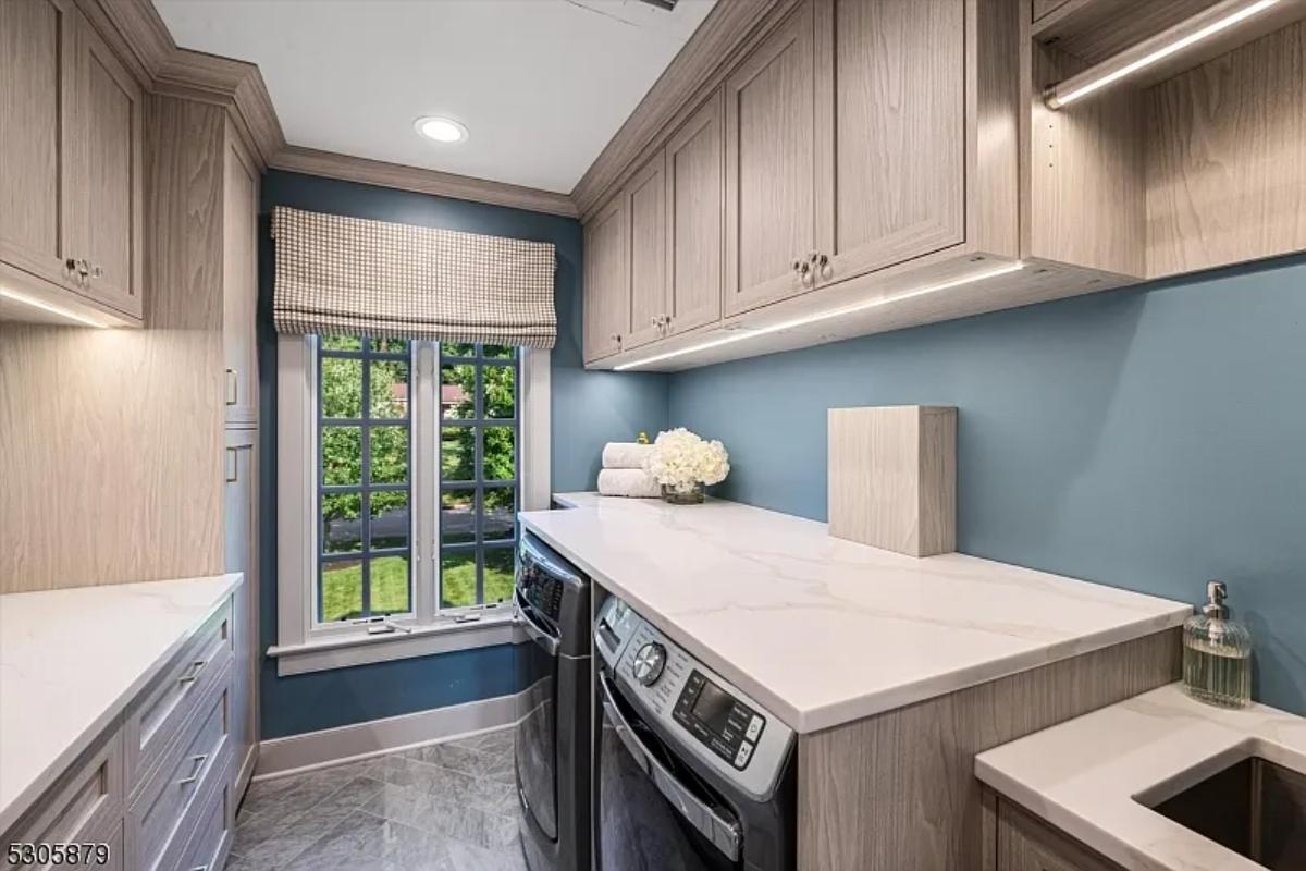 Laundry room with custom cabinetry.
