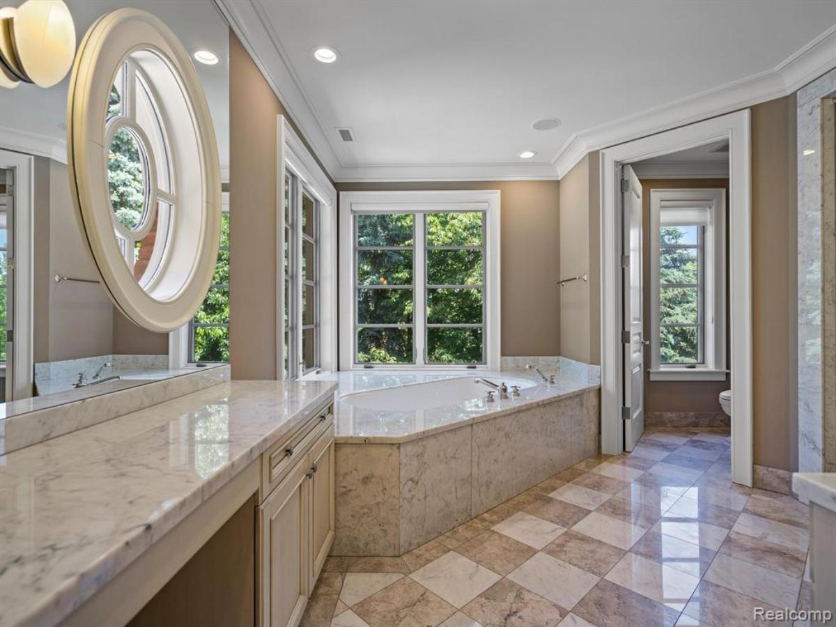 Bathroom with a custom-made vanity and a soaking tub.