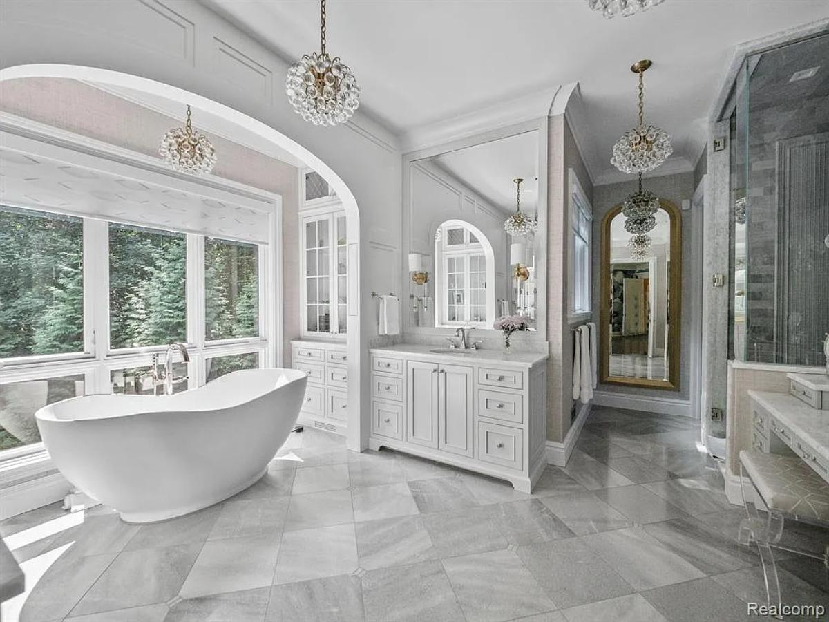 Bathroom with a custom-made vanity, a soaking tub and a walk-in shower.