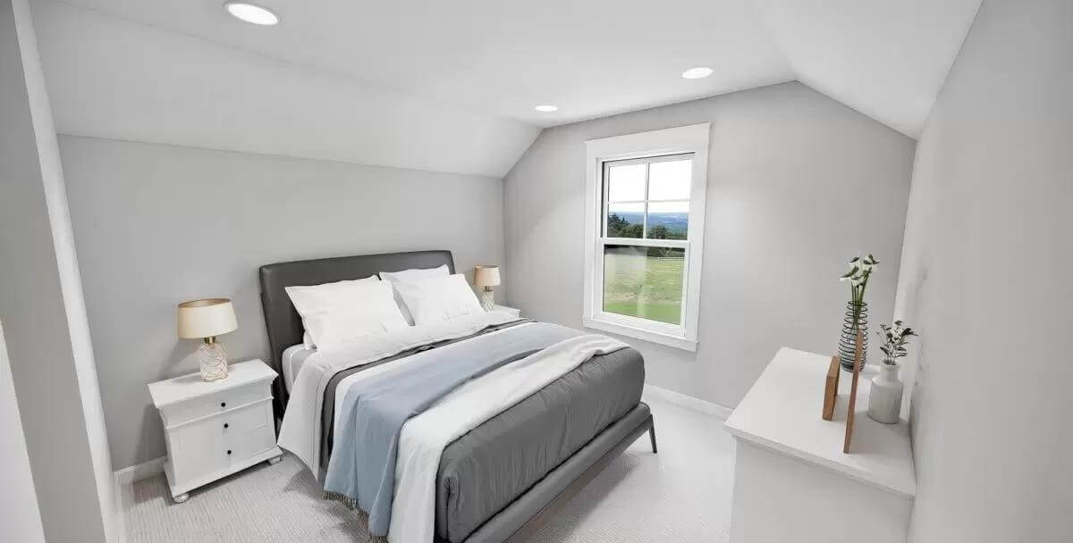 Bedroom with a platform bed and white cabinets under a coved ceiling.