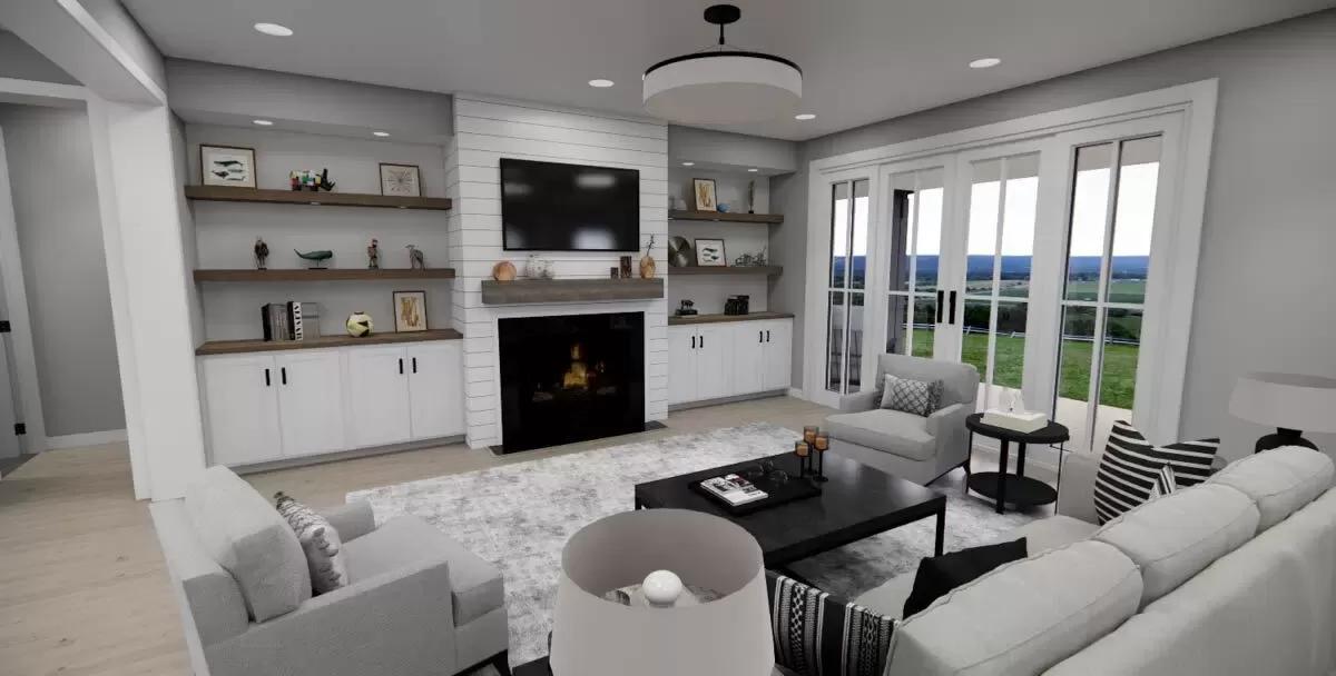 Great room with a sectional sofa, matching chairs, and a fireplace with a TV on top.