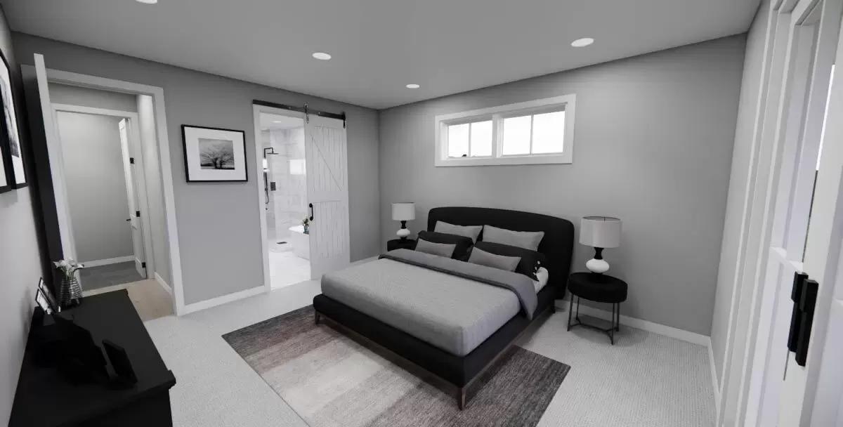 Primary bedroom with a black bed and an ensuite bathroom.